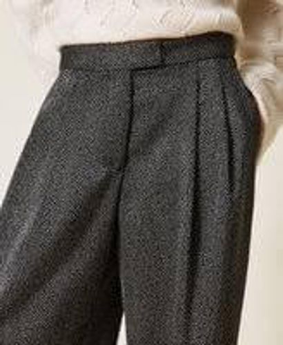 Palazzo trousers with laminated print