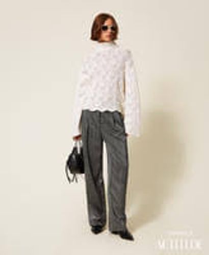 Palazzo trousers with laminated print
