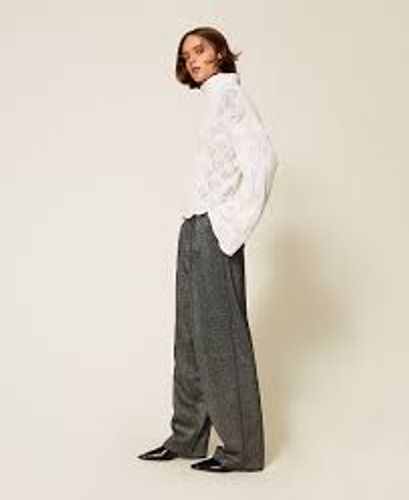 Palazzo trousers with laminated print
