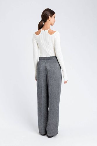 Palazzo trousers with laminated print