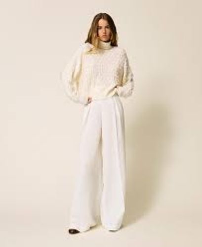 Turtleneck jumper with fringes