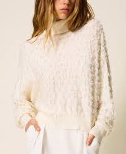 Turtleneck jumper with fringes