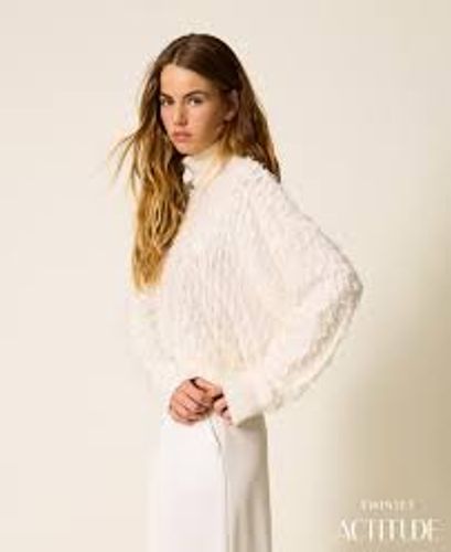 Turtleneck jumper with fringes