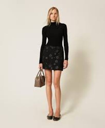 Bouclé miniskirt with flowers and sequins