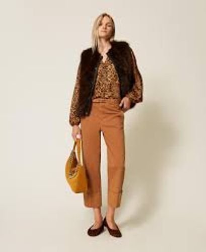 Sleeveless faux fur coat with buttons