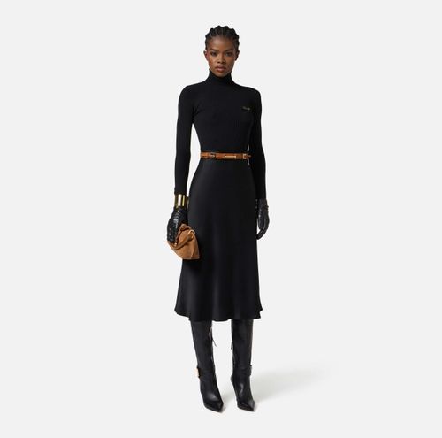 Dress in ribbed knit and satin fabrics with pocket