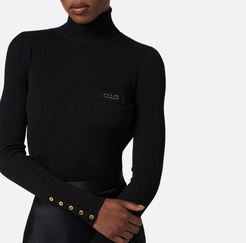 Dress in ribbed knit and satin fabrics with pocket