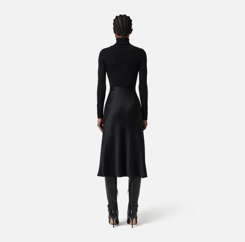 Dress in ribbed knit and satin fabrics with pocket