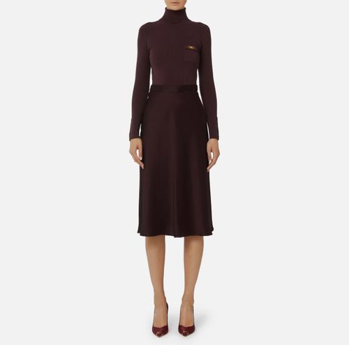 Dress in ribbed knit and satin fabrics with pocket