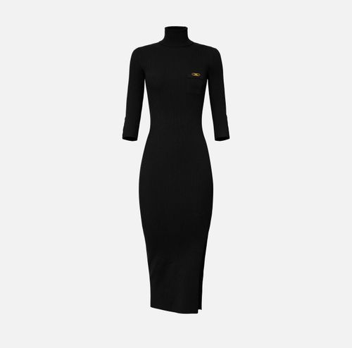 Dress in ribbed knit fabric with breast pocket