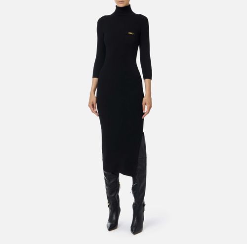 Dress in ribbed knit fabric with breast pocket