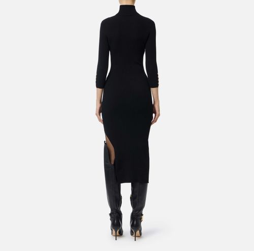 Dress in ribbed knit fabric with breast pocket