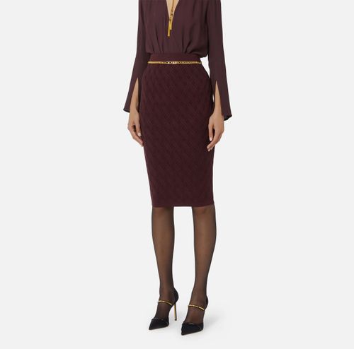 Skirt in knit fabric with diamonds and jewel details