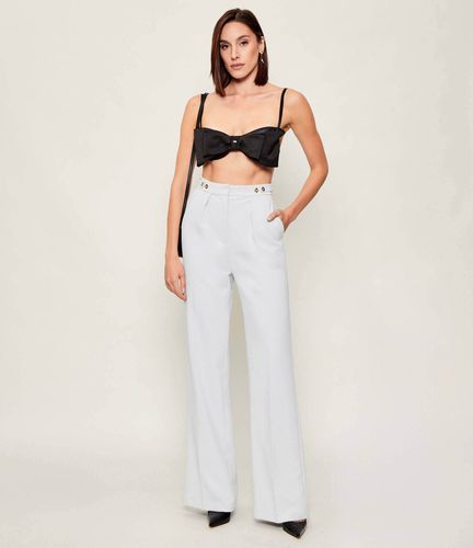 Trousers in crêpe fabric with jewel accessory