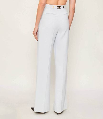 Trousers in crêpe fabric with jewel accessory