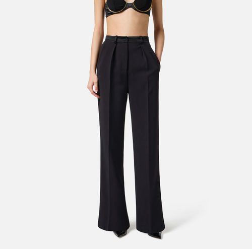 Trousers in lightweight crêpe fabric with tuxedo details