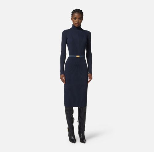 Dress in ribbed knit fabric with belt