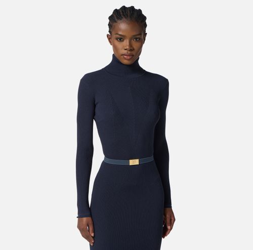 Dress in ribbed knit fabric with belt