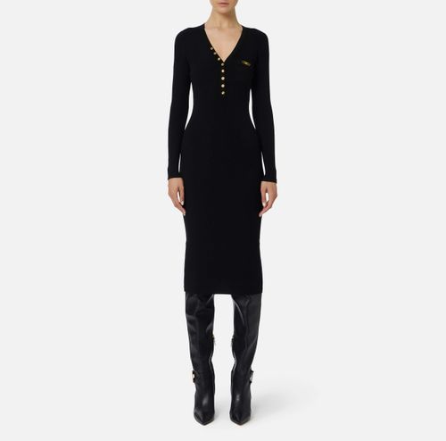 Dress in ribbed knit fabric with breast pocket