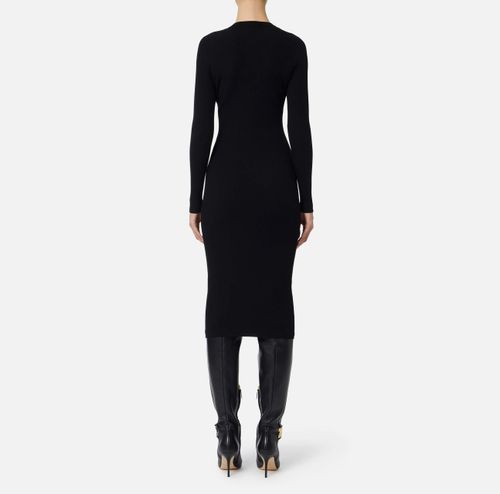 Dress in ribbed knit fabric with breast pocket