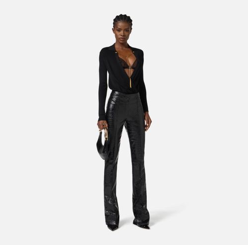 Trousers with crocodile print