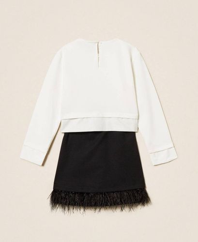 Blouse and skirt with feathers