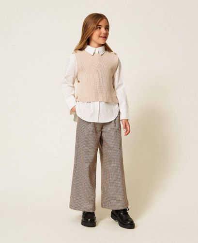 Sleeveless knit jumper with Oval T buttons