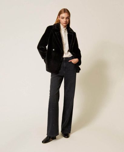 Black five-pocket jeans with rhinestones