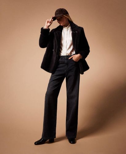 Black five-pocket jeans with rhinestones