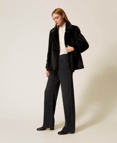Black five-pocket jeans with rhinestones