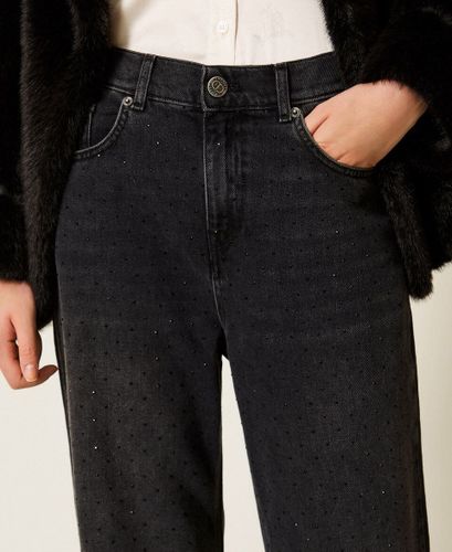Black five-pocket jeans with rhinestones