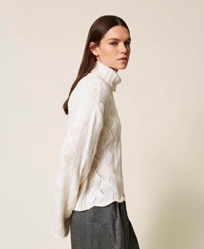 Wool blend turtle neck jumper with scalloped hem
