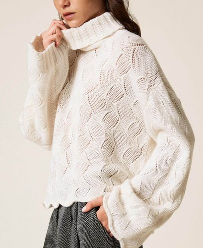 Wool blend turtle neck jumper with scalloped hem