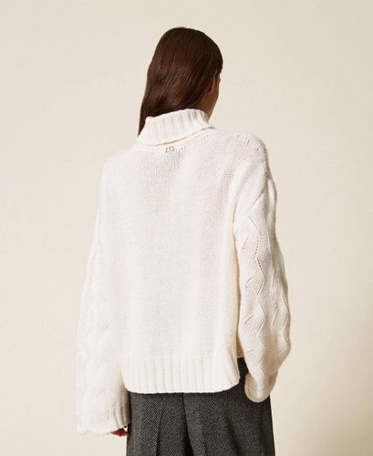 Wool blend turtle neck jumper with scalloped hem