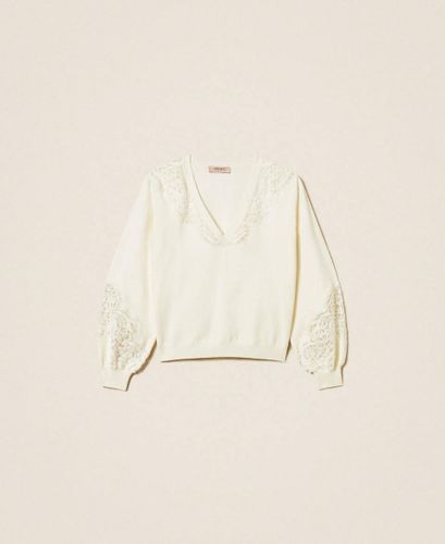 Jumper with embroidered inlays