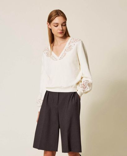 Jumper with embroidered inlays