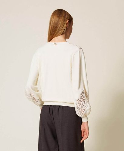Jumper with embroidered inlays