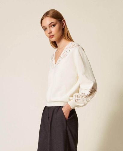 Jumper with embroidered inlays