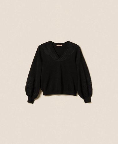 Jumper with embroidered inlays