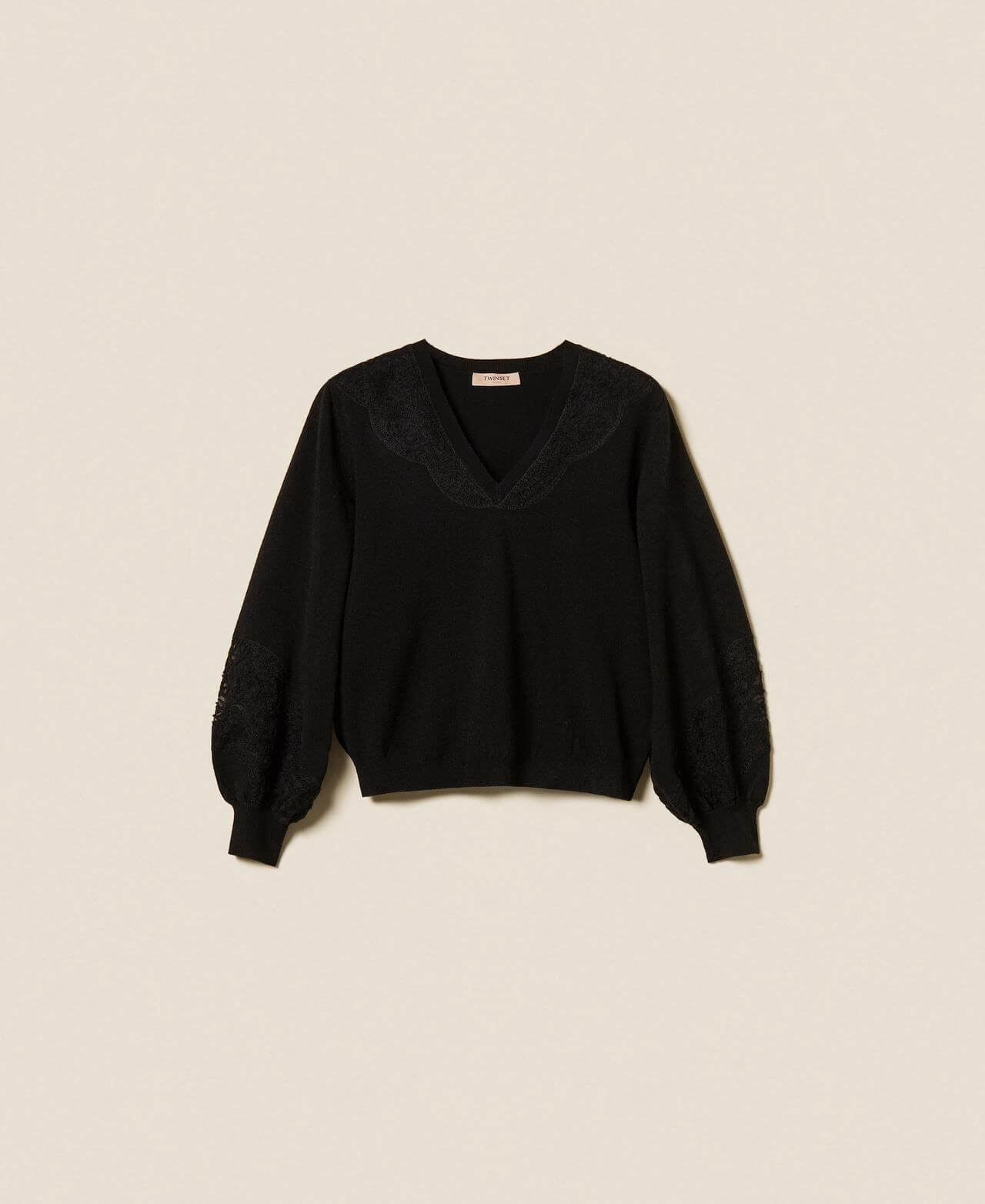 Jumper with embroidered inlays
