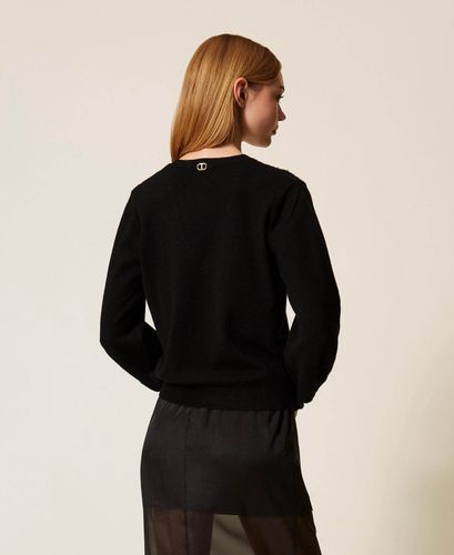 Jumper with embroidered inlays