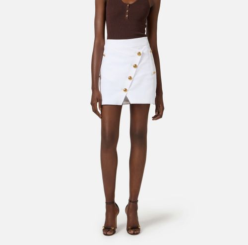 Cotton gabardine miniskirt with jewel buttons