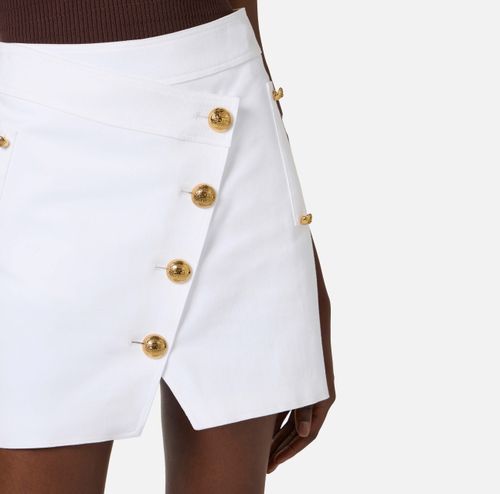 Cotton gabardine miniskirt with jewel buttons
