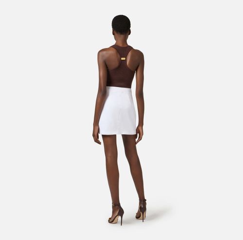 Cotton gabardine miniskirt with jewel buttons