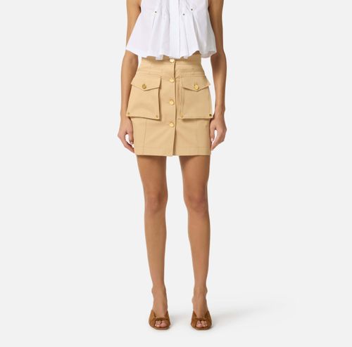 Cotton gabardine miniskirt with cargo pockets