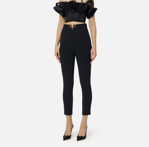 Trousers in double layer stretch crêpe fabric with logo details