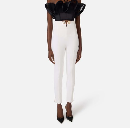 Trousers in double layer stretch crêpe fabric with logo details