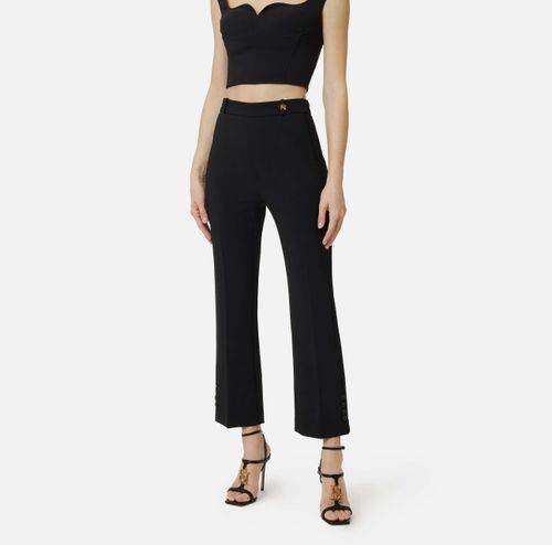 Trousers in double layer stretch crêpe fabric with logo charm