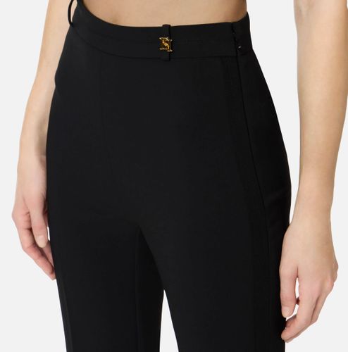 Trousers in double layer stretch crêpe fabric with logo charm