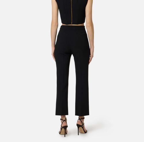 Trousers in double layer stretch crêpe fabric with logo charm
